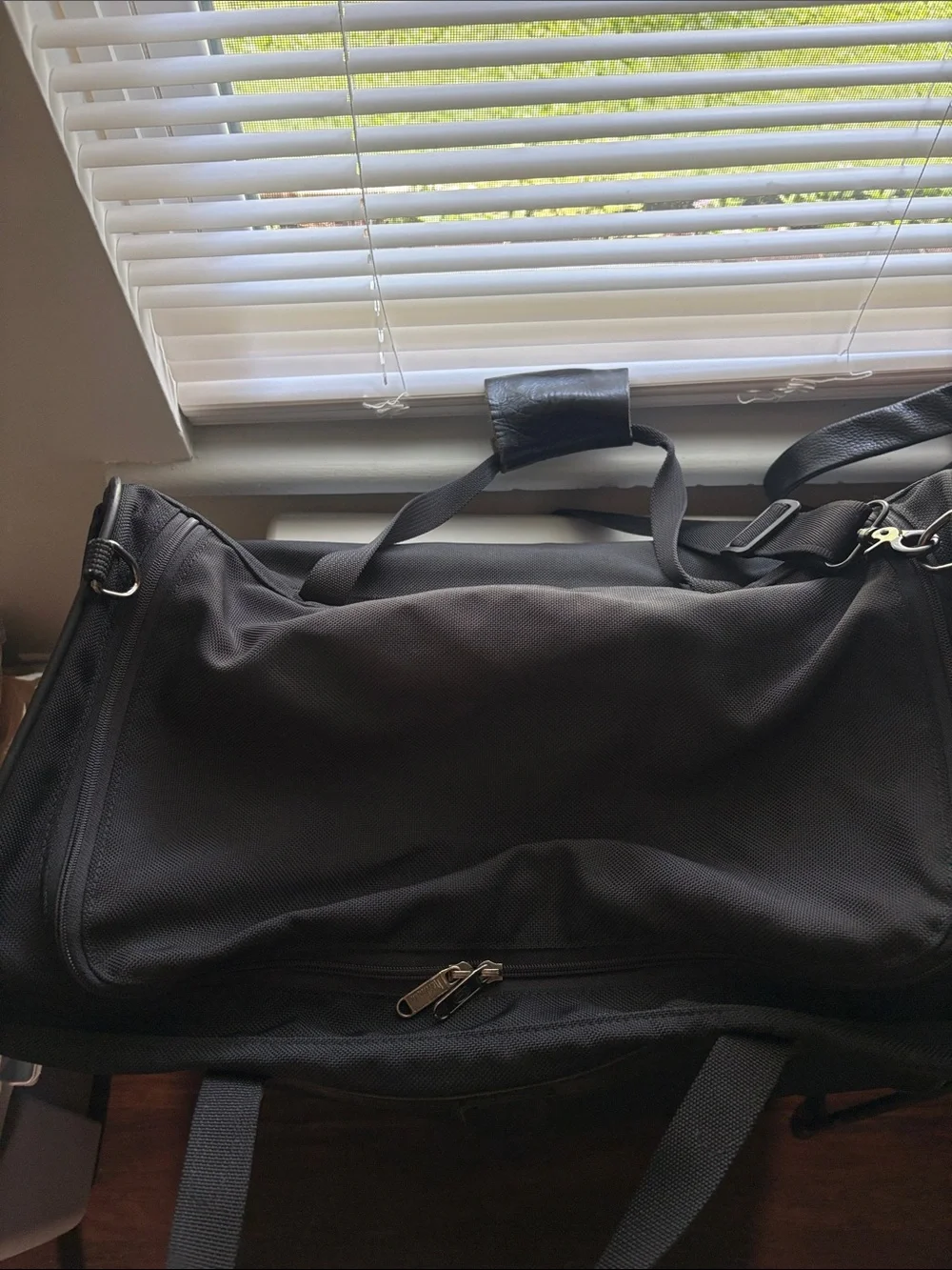 Hartmann zip around nylon and leather duffle style bag.